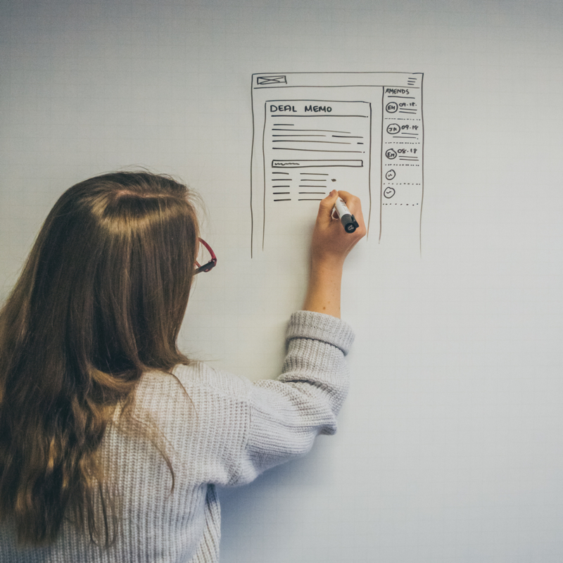 Liz drawing on the whiteboard